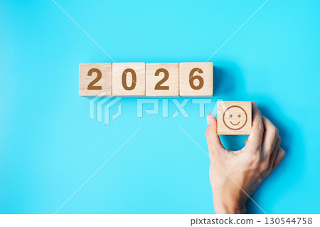 Smile face block with 2026 text on blue background. Satisfaction, feedback, Review and New Year concepts 130544758