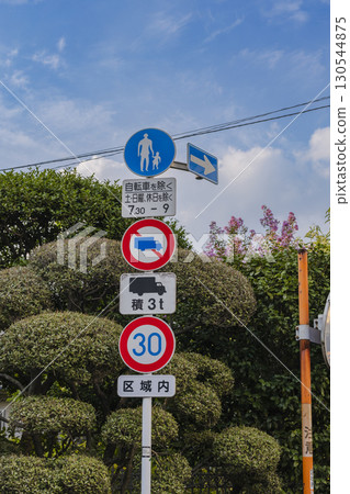 Road scene with multiple traffic signs Road scene with multiple traffic signs 130544875