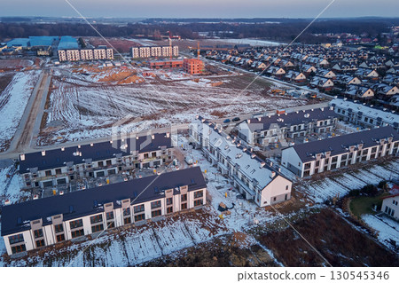Aerial view of residential housing construction in winter 130545346