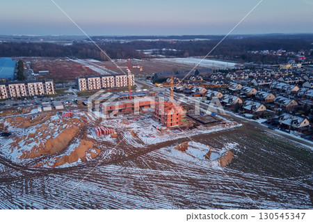 Construction site with cranes and new buildings 130545347