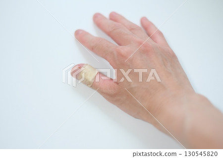Thumb with bandage on 130545820