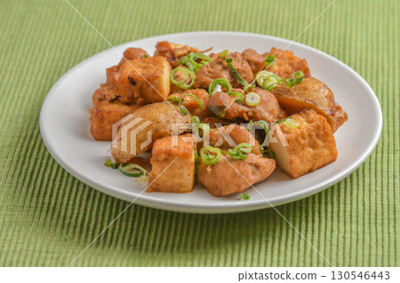 Deep-fried tofu, potatoes and chicken stir-fried with oyster sauce Deep-fried tofu, potatoes and chicken stir-fried with oyster sauce 130546443