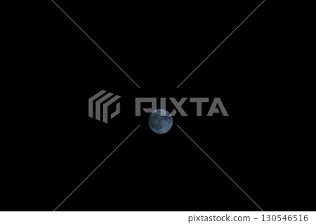 A round moon floating in the night sky A round moon floating in the night sky 130546516