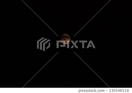 A slightly cloudy moon floating in the night sky A slightly cloudy moon floating in the night sky 130546518