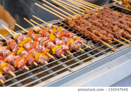 Fresh and delicious street grilled skewers 130547048