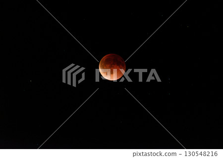 Beautiful lunar eclipse with red moon against dark night sky Blood moon Beautiful lunar eclipse with red moon against dark night sky Blood moon 130548216