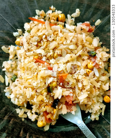 Traditional Indian Poha Breakfast with Vegetables 130548333