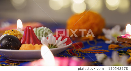 Diwali Celebration. Colorful Sweets and Diyas on Table. Diwali Celebration. Colorful Sweets and Diyas on Table. 130548378