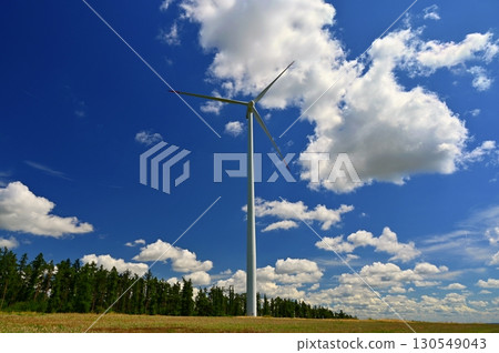 Wind power plant on meadow. Concept for energy, technology and green power with clean environment. 130549043