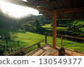 Wooden balcony with rice fields, view from the hut next to the rice fields 130549377