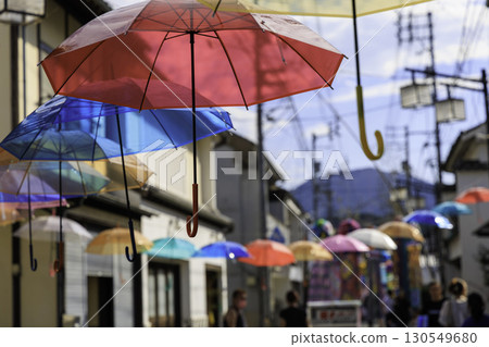 Colorful umbrella decorations brighten up the sky at the Uchiko Bamboo Grass Festival in Ehime Prefecture 130549680