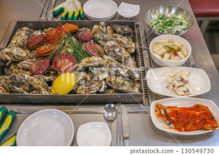 Korean Seafood Food. Steamed oysters and scallops Korean Seafood Food. Steamed oysters and scallops 130549730