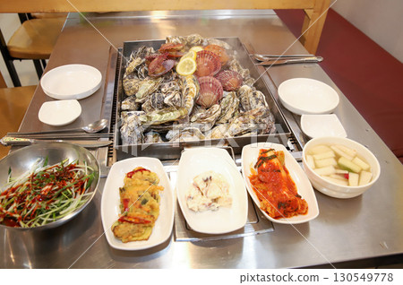 Korean Seafood Food. Steamed oysters and scallops 130549778