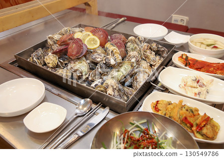 Korean Seafood Food. Steamed oysters and scallops Korean Seafood Food. Steamed oysters and scallops 130549786
