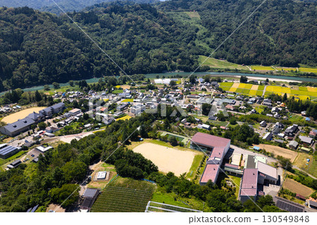 View of the Ikusaka townscape from above Ikusaka Elementary School, Ikusaka Village, Nagano Prefecture (aerial photography by drone) View of the Ikusaka townscape from above Ikusaka Elementary School, Ikusaka Village, Nagano Prefecture (aerial photography by drone) 130549848