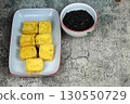 Tahu goreng or Fried tofu with petis or black shrimp paste dipping sauce, a popular Indonesian snack from Surabaya, East Java. 130550729
