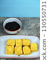 Tahu goreng or Fried tofu with petis or black shrimp paste dipping sauce, a popular Indonesian snack from Surabaya, East Java. 130550731