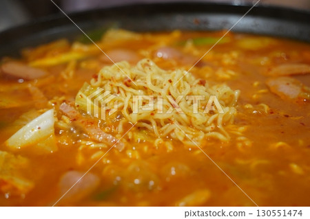 Closeup of Korean Army Stew Budae Jjigae with Noodles and Sausage 130551474