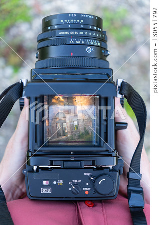 A woman shoot on vintage medium format camera 130551792