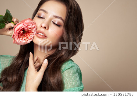 Beautiful young woman a rose flower 130551793