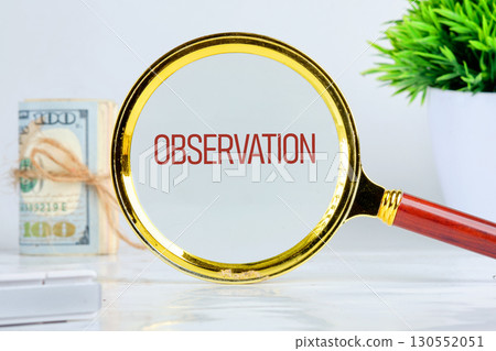 OBSERVATION text showed through a magnifying glass on a light background. Attention to detail, and analytical thinking concept OBSERVATION text showed through a magnifying glass on a light background. Attention to detail, and analytical thinking concept 130552051