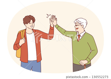 Intergenerational friendship between teenager and old man high-fiving each other as sign solidarity Intergenerational friendship between teenager and old man high-fiving each other as sign solidarity 130552273