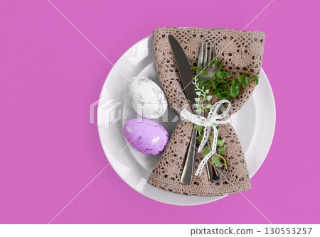 Easter celebration concept. Top view Napkin white plate eggs, isolated background, banner 130553257