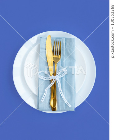 Easter celebration concept. Top view Napkin white plate eggs, isolated background, banner 130553268