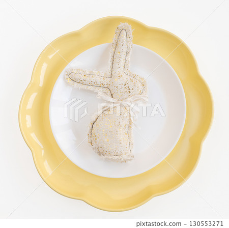 Easter celebration concept. Top view vertical white yellow plate eggs, isolated background, banner 130553271