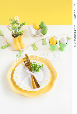 Easter celebration concept. Top view vertical empty dishes Easter eggs, isolated background, banner 130553286