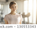 Woman in her 20s training gym portrait looking at camera 130553343