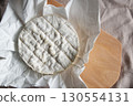 Camembert cheese, a soft and creamy cheese of French origin 130554131