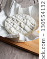 Camembert cheese, a soft and creamy cheese of French origin 130554132