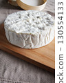 Camembert cheese, a soft and creamy cheese of French origin 130554133