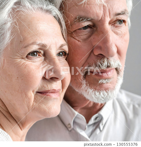 Senior couple portrait with gentle smiles and soft closeness 130555376