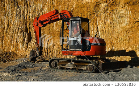 Close up of red excavator at Close up of red excavator at 130555836