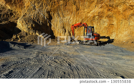 Excavator working at quarry Excavator working at quarry 130555838