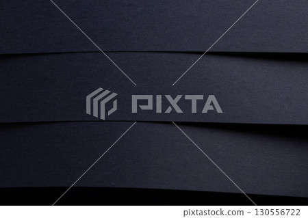 Premium navy blue designer paper texture with an elegant geometric design. Deep, dark shadows Premium navy blue designer paper texture with an elegant geometric design. Deep, dark shadows 130556722