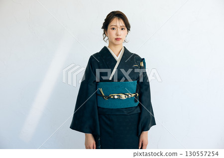 Portrait of an elegant woman wearing a black furisode Portrait of an elegant woman wearing a black furisode 130557254