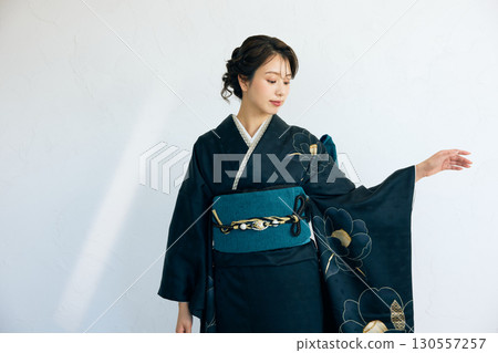 Portrait of an elegant woman wearing a black furisode Portrait of an elegant woman wearing a black furisode 130557257