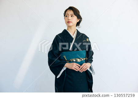 Portrait of an elegant woman wearing a black furisode Portrait of an elegant woman wearing a black furisode 130557259
