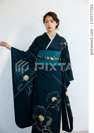 Portrait of an elegant woman wearing a black furisode Portrait of an elegant woman wearing a black furisode 130557265