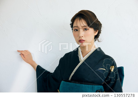 Portrait of an elegant woman wearing a black furisode Portrait of an elegant woman wearing a black furisode 130557278