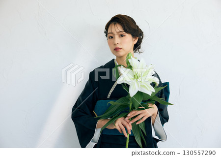 Portrait of an elegant woman wearing a black furisode Portrait of an elegant woman wearing a black furisode 130557290