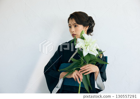 Portrait of an elegant woman wearing a black furisode 130557291