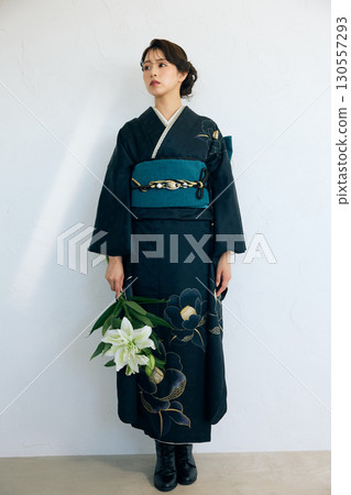 Portrait of an elegant woman wearing a black furisode 130557293