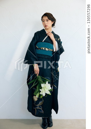 Portrait of an elegant woman wearing a black furisode Portrait of an elegant woman wearing a black furisode 130557296