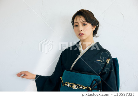 Portrait of an elegant woman wearing a black furisode 130557325