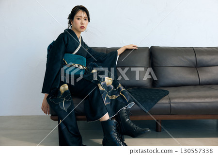 Portrait of an elegant woman wearing a black furisode Portrait of an elegant woman wearing a black furisode 130557338