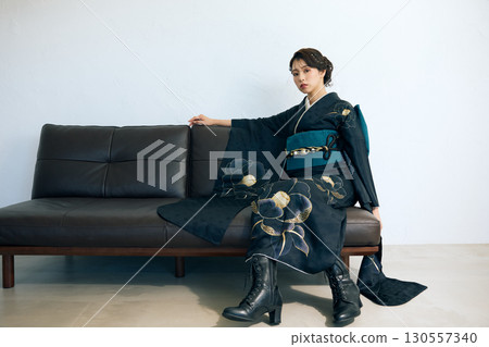 Portrait of an elegant woman wearing a black furisode Portrait of an elegant woman wearing a black furisode 130557340